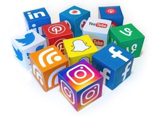 Social Media Logo with cubes containing icons for social media platforms like Facebook, Twitter, Instagram, Snap Chat, YouTube, Pinterest, RSS feeds, Linked In, Vimeo.
