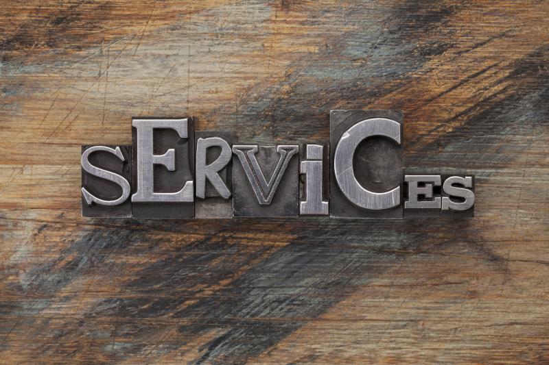 Concept Photograph for Services. Word in vintage letterpress on grunge painted wood