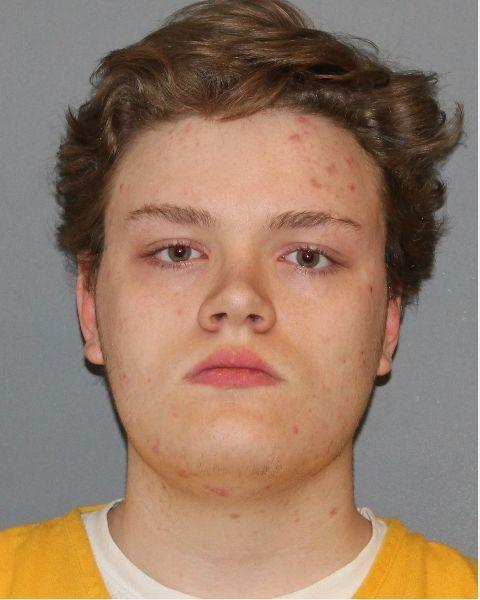 A photo of Brian Cohee, II wearing yellow inmate scrubs.