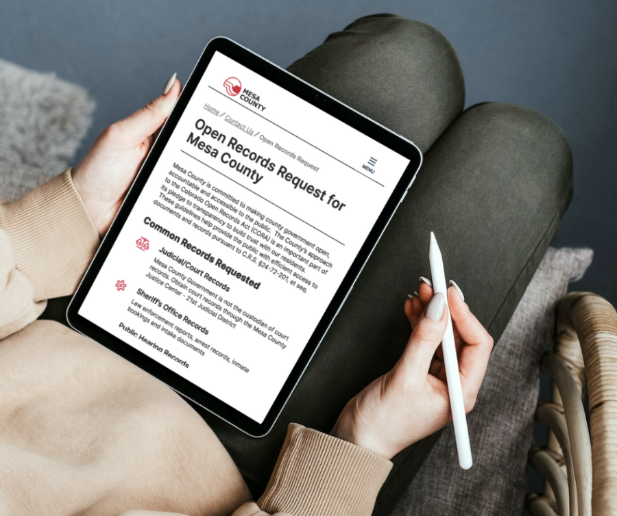 An iPad show Mesa County's Colorado Open Records Act (CORA) webpage.