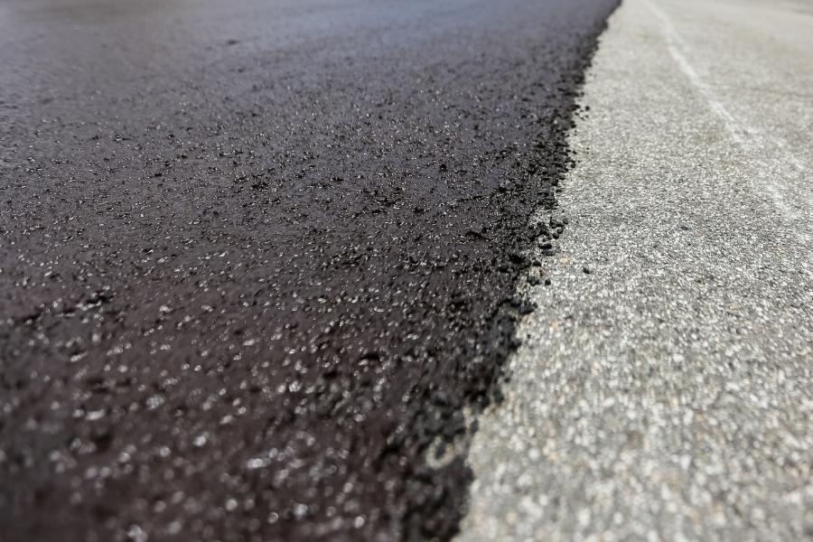 New paved road next to old paved road. 