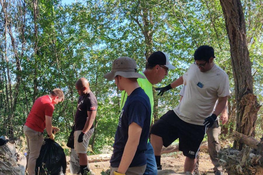 A group of youth cleans up the walking trail at 3240 C 1/2 Rd near the Clifton Nature Park.