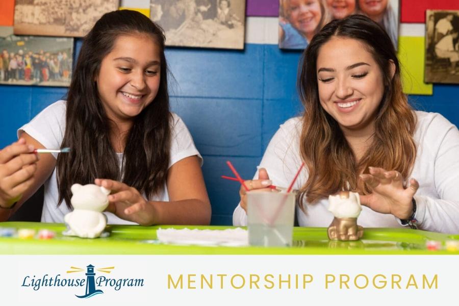One child and one adult smiling as they paint pottery with blue and yellow Lighthouse Program logo and yellow text reading, Mentorship Program.