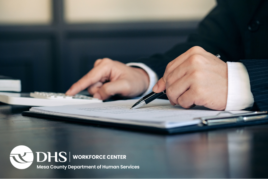Hands filling out a form with WFC logo in the bottom left corner.