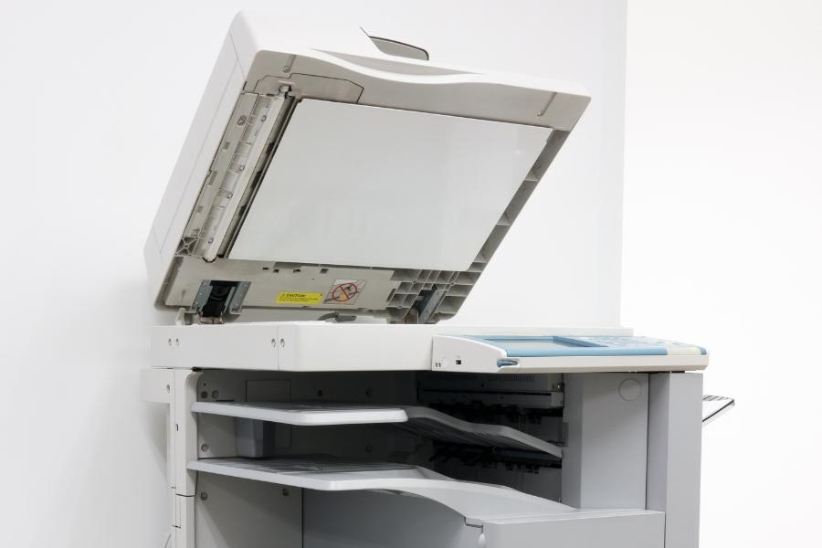 A white commercial printer. 