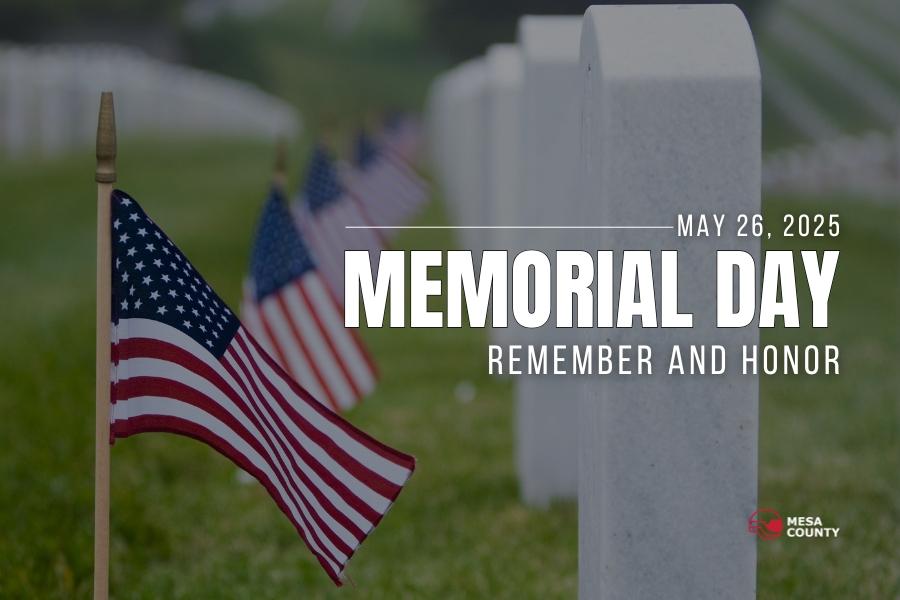 American flags lined up next to white headstones and white text reading MAY 26, 2025, MEMORIAL DAY REMEMBER AND HONOR, with the Mesa County logo on the bottom right. 