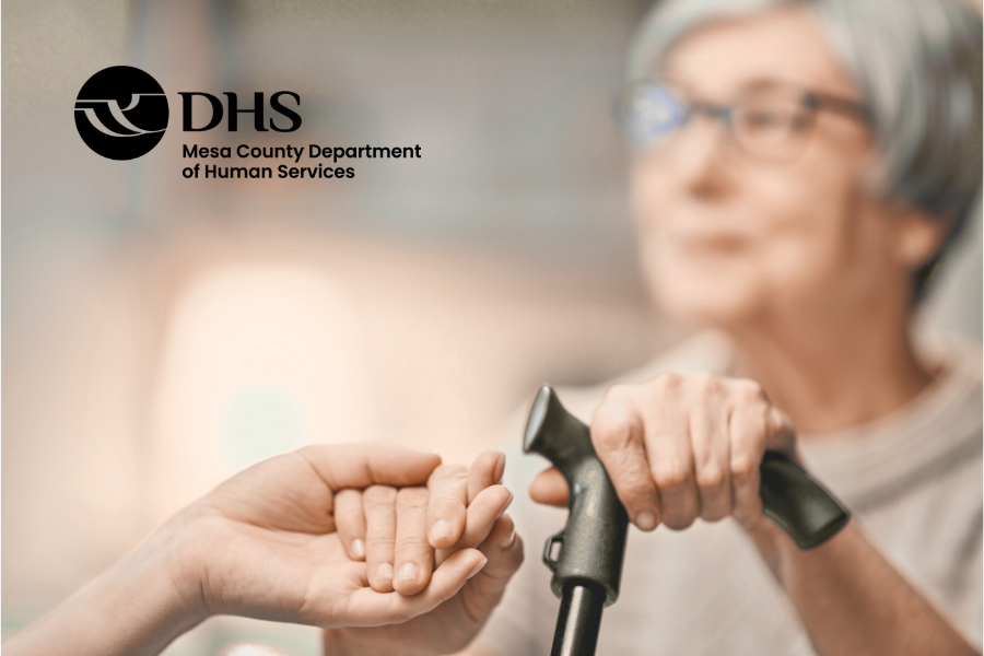 MCDHS logo over blurred image of elderly woman with a cane holding someone's hand.