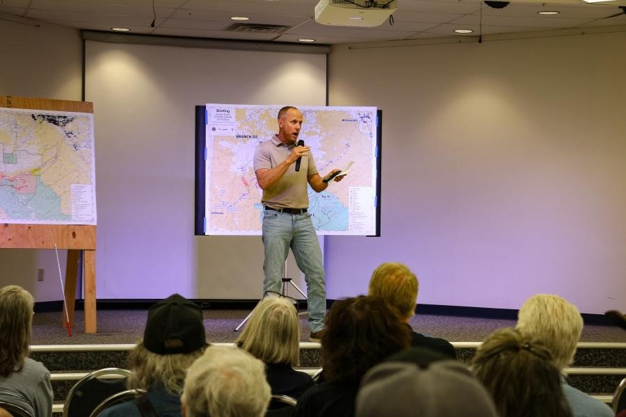 A man speaking into a microphone.