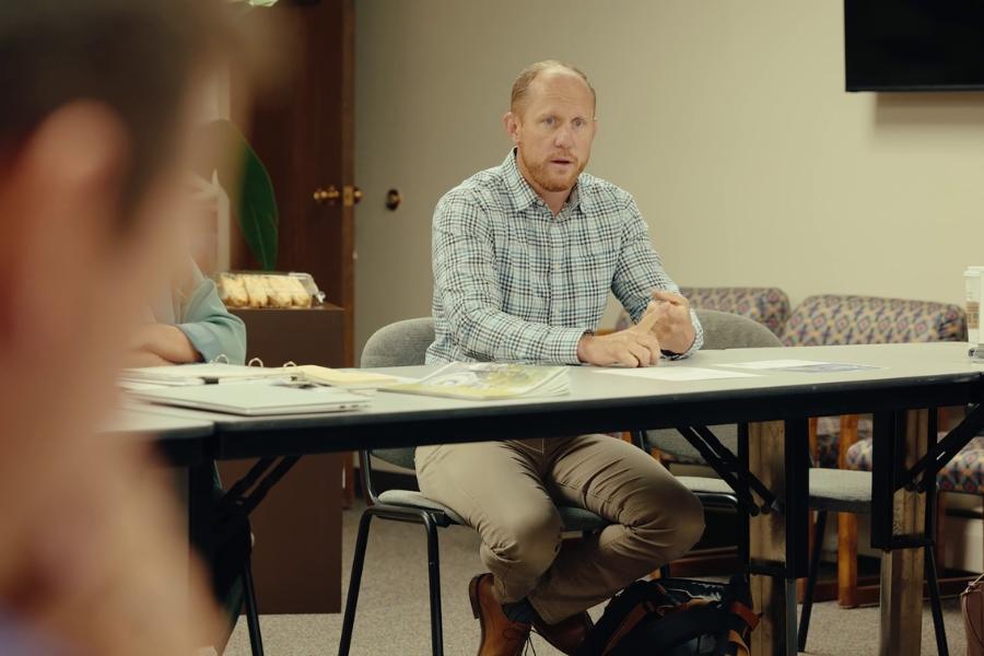 A man sitting at a table. 
