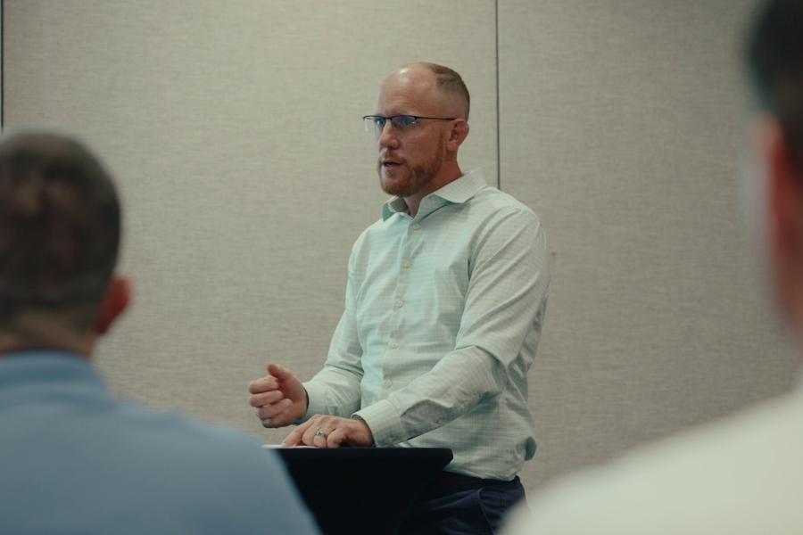 A man speaking at a lectern. 