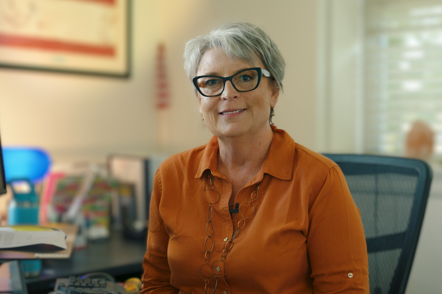 Sheila Reiner smiling in an office. 