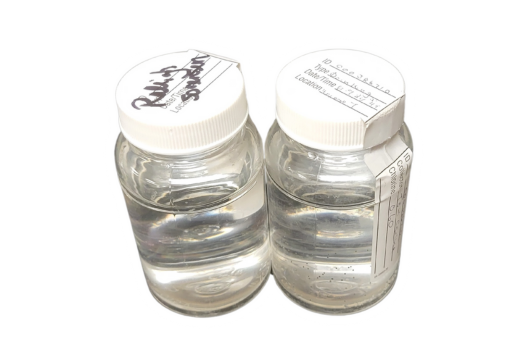 two water testing samples in small glass bottles
