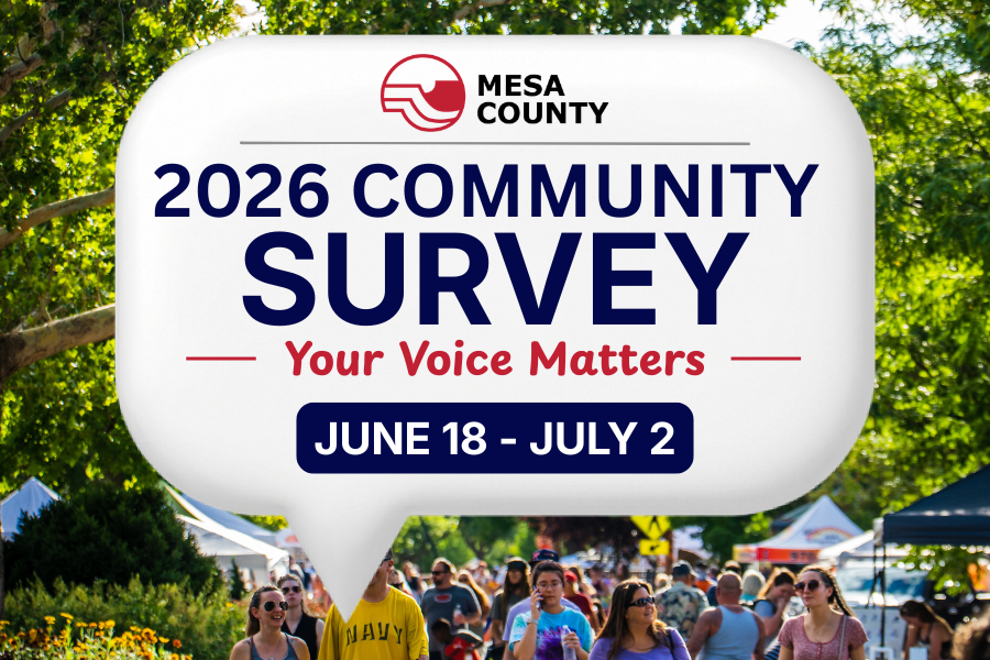 Graphic promoting the Mesa County 2026 Community Survey. Text reads, "2026 Community Survey," "Your Voice Matters," and "June 18–July 2." The Mesa County logo appears above the text inside a white speech bubble over a photo of residents attending a community event beneath leafy trees.