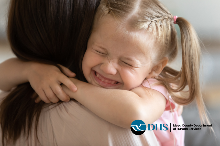 Child embracing a foster parent